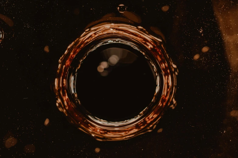 an image of a black hole in the sky, an album cover, pexels contest winner, conceptual art, brown water, bubbly, panel of black, brown