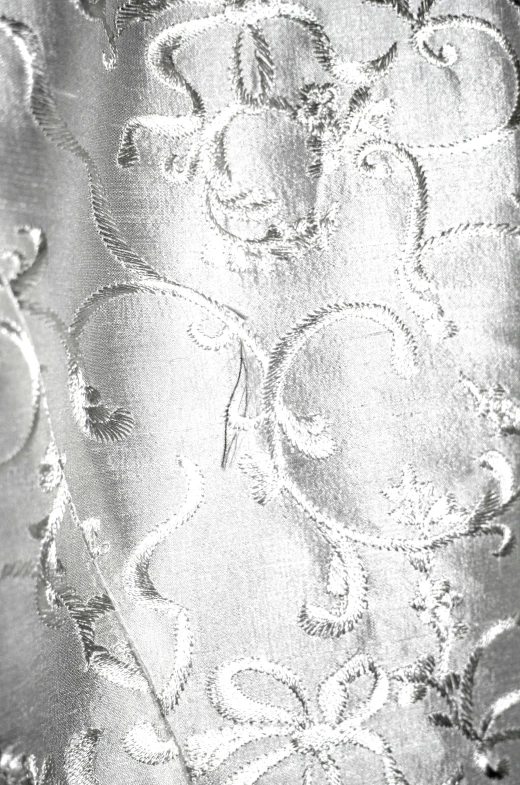 a close up of a tie on a mannequin mannequin mannequin mannequin mannequin mannequin manne, an etching, inspired by Master of the Embroidered Foliage, rococo, in a silver silk robe, pearlescent white, 20th century, swirling fabric