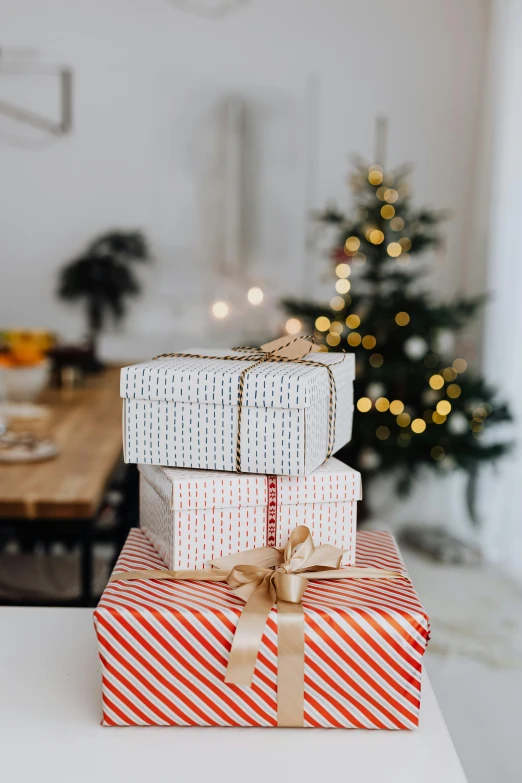 presents stacked on top of each other in front of a christmas tree, pexels contest winner, happening, on a white table, manuka, white box, thumbnail