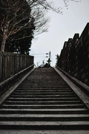 a black and white photo of a set of stairs, by Yasushi Sugiyama, unsplash, mingei, be running up that hill, nagasaki, ominous photo, cementary