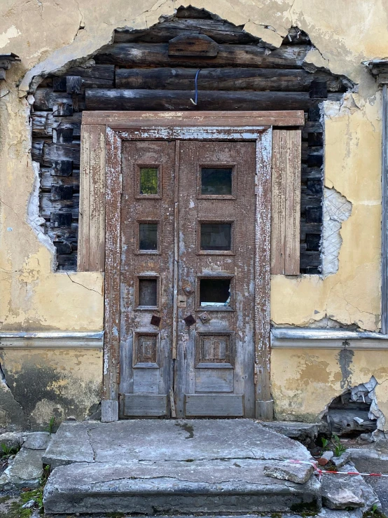 a door that is on the side of a building, an album cover, inspired by Károly Markó the Elder, pexels contest winner, abandoned polish mansion, demolition, 1700s, front view 2 0 0 0