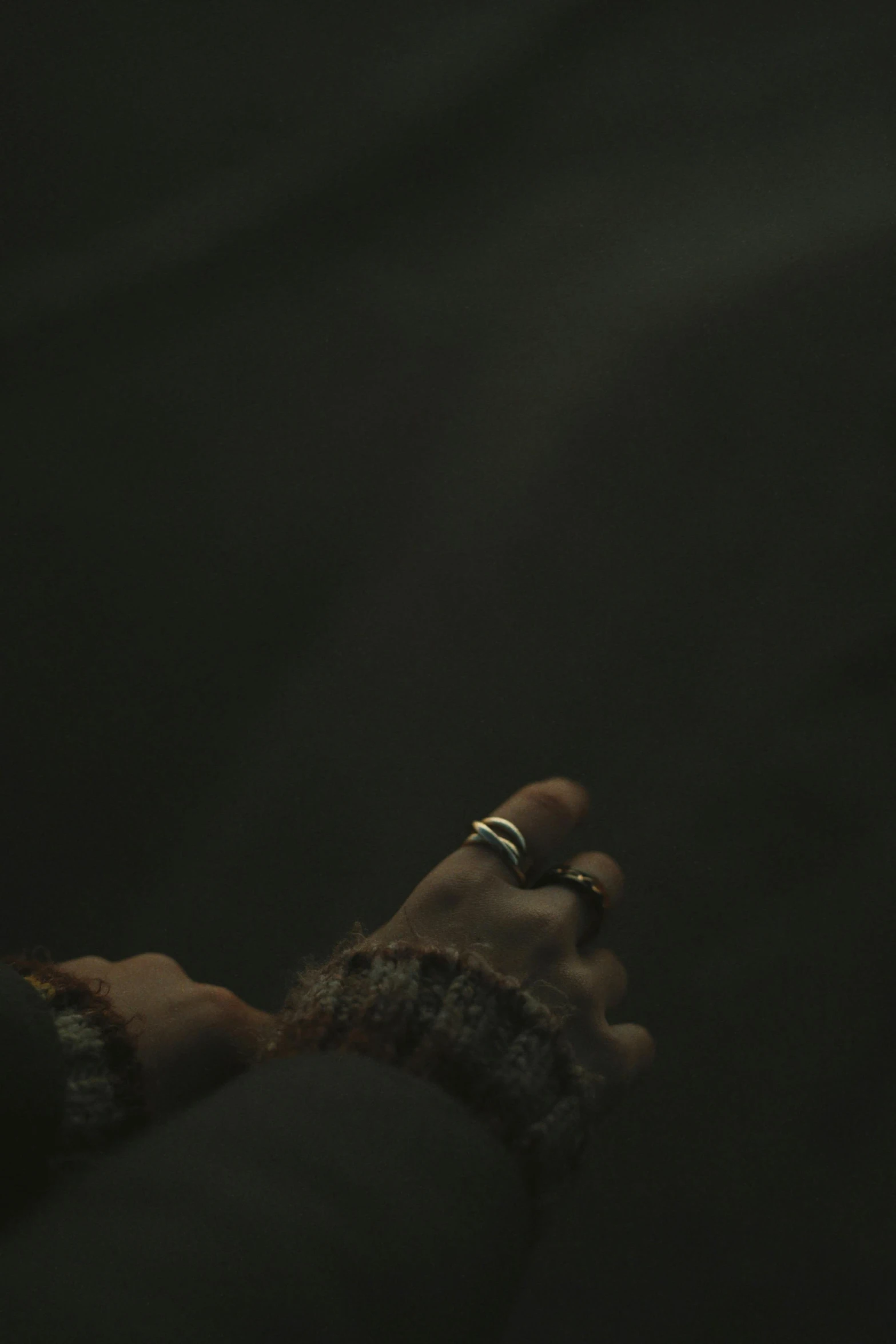 a close up of a person holding a cell phone, by Elsa Bleda, hurufiyya, runic rings, overcast! cinematic focus, bill henson, whiterun hold