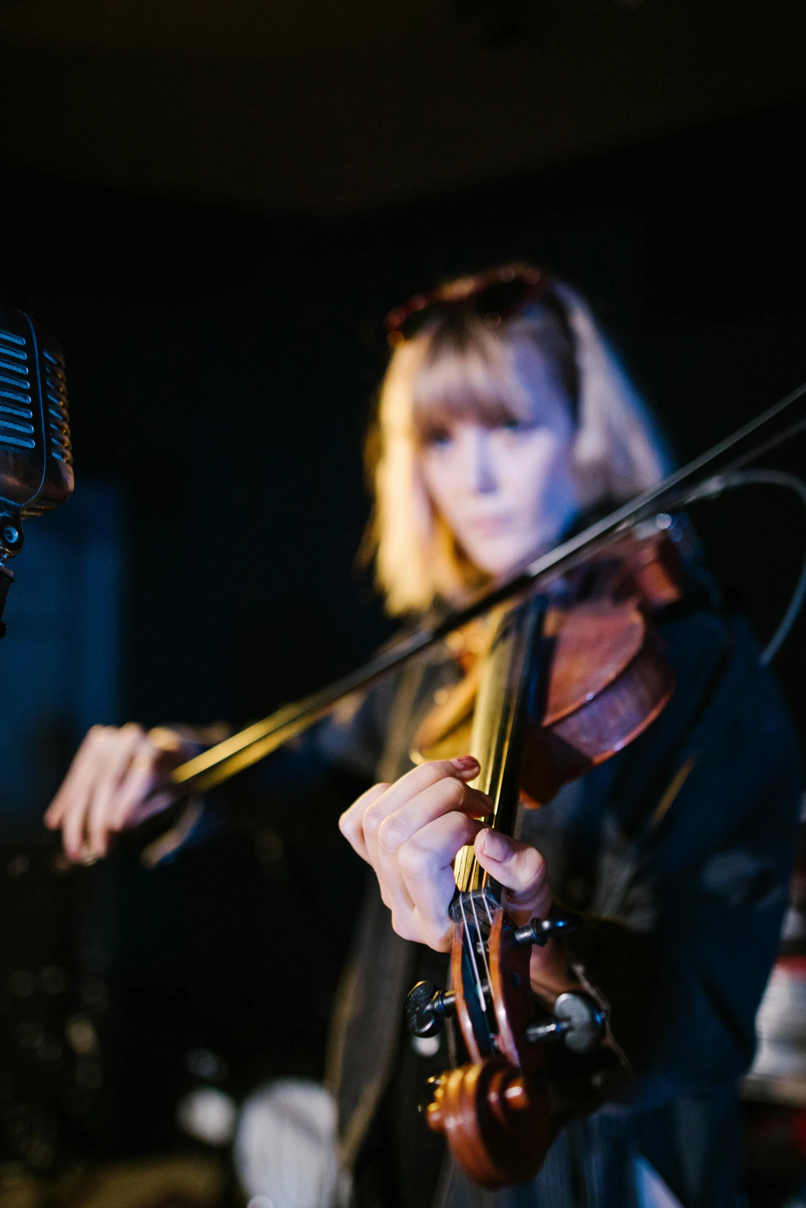 a man standing next to a woman holding a violin, an album cover, unsplash, beth cavener, live performance, panorama, profile image