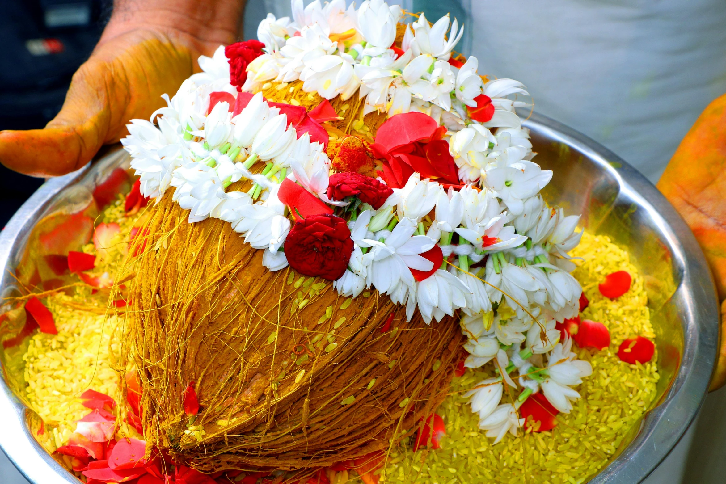 a close up of a person holding a bowl of food, hurufiyya, covered with flowers, in a temple, coconuts, profile image