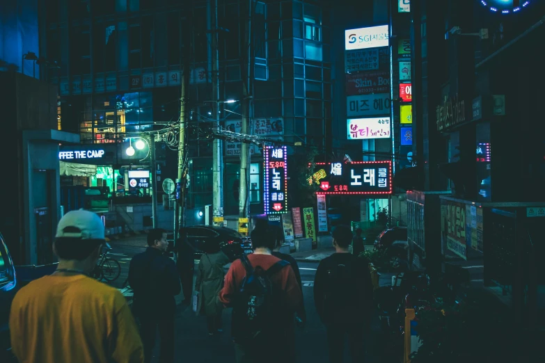 a group of people walking down a street at night, by Jang Seung-eop, pexels contest winner, pixel art, colorful signs, korean, unsplash 4k, 90s photo