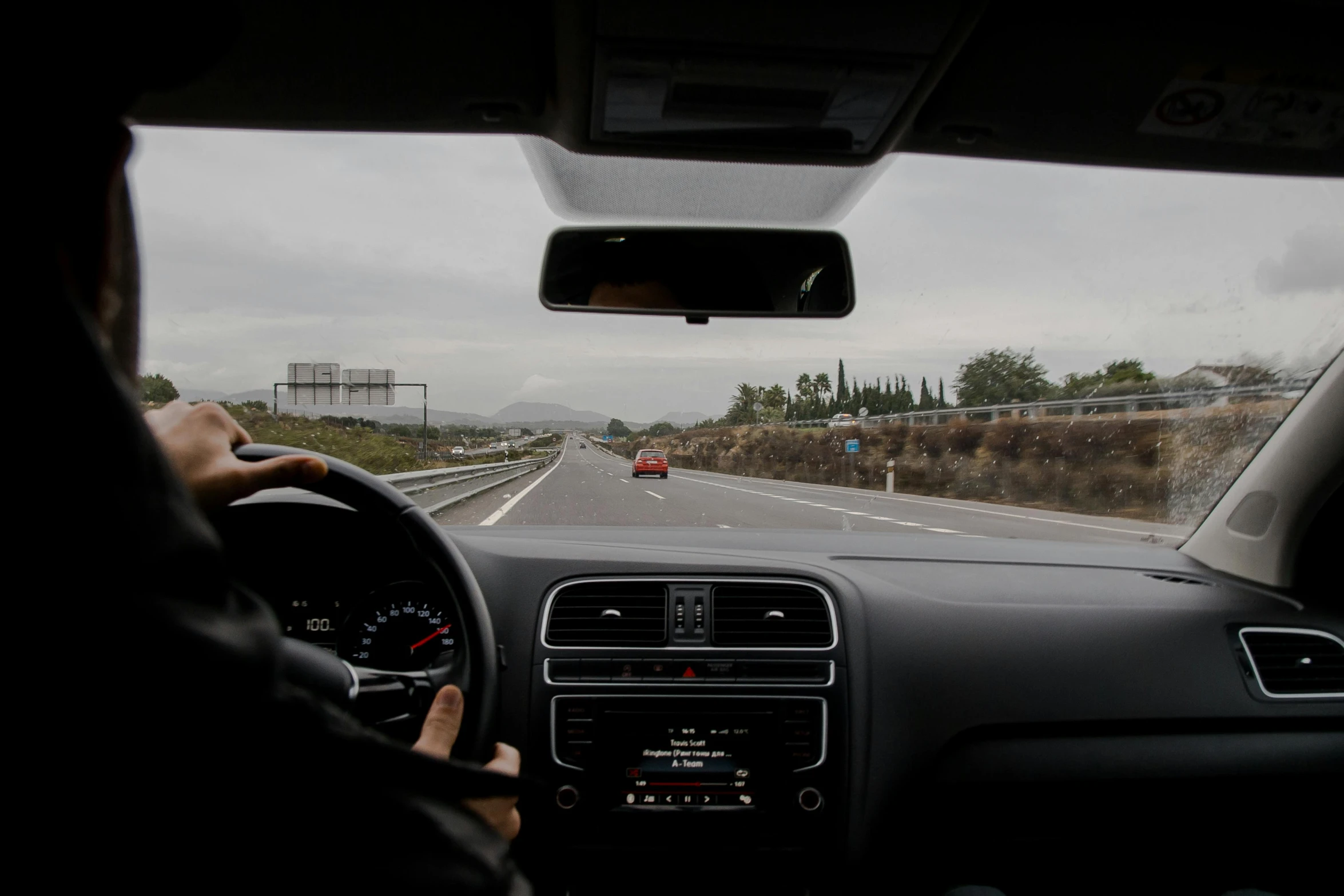 a man driving a car on a highway, a picture, unsplash, in spain, square, view from inside, 15081959 21121991 01012000 4k