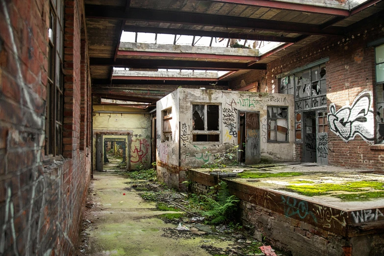 an abandoned building with graffiti all over it, inspired by Thomas Struth, pexels contest winner, mossy buildings, beeple. hyperrealism, ignant, wrecked buildings