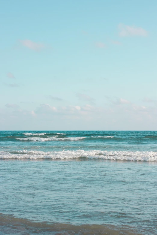 a man riding a wave on top of a surfboard, unsplash, minimalism, varadero beach, sparsely populated, 8 k -, glistening seafoam