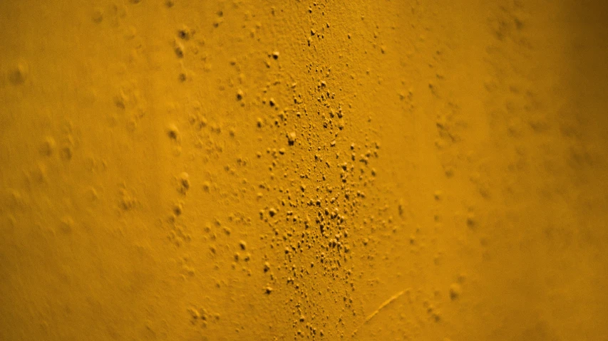 a close up of a glass of beer, inspired by Lucio Fontana, analytical art, yellow ochre, heavy pigment, atmospheric dust, hansa yellow