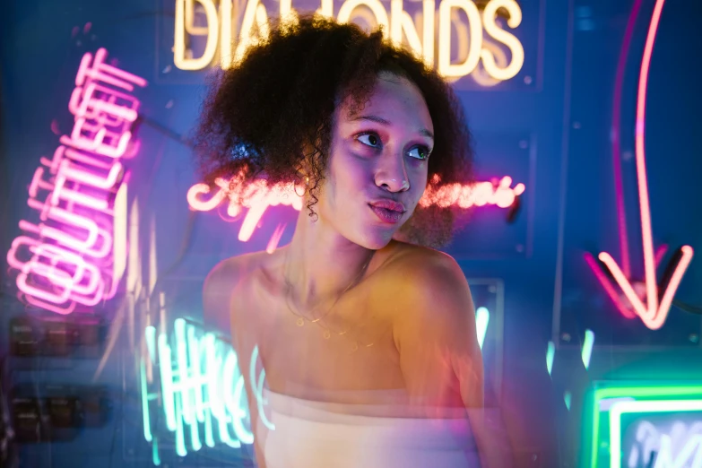 a woman standing in front of neon signs, pexels contest winner, diamonds around her neck, ashteroth, mixed race woman, smooth in the background