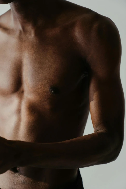 a close up of a shirtless man holding a cell phone, pexels contest winner, renaissance, light-brown skin, physical : tinyest midriff ever, sparse chest hair, silhouette of man