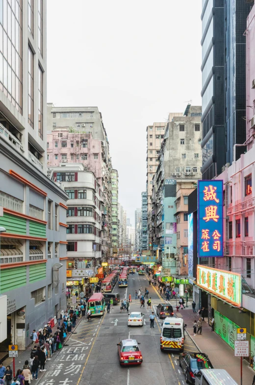 a city street filled with lots of traffic next to tall buildings, inspired by Zhang Kechun, trending on unsplash, colorful architecture, tekkon kinkreet, full frame image, “wide shot