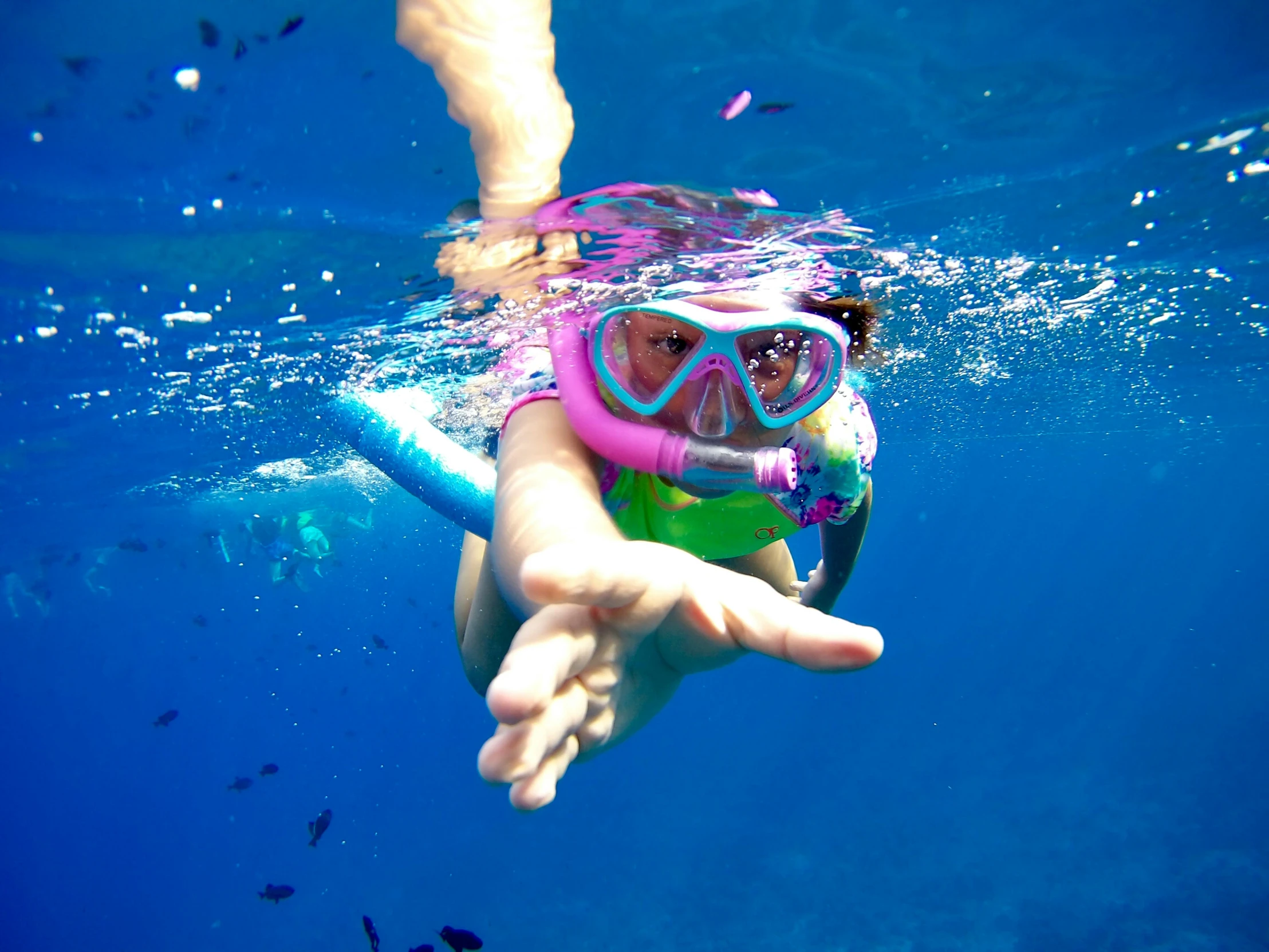 a person swimming in the water with a snorg, pexels contest winner, blue and pink colors, scuba mask, kids, ( ( ( kauai ) ) )