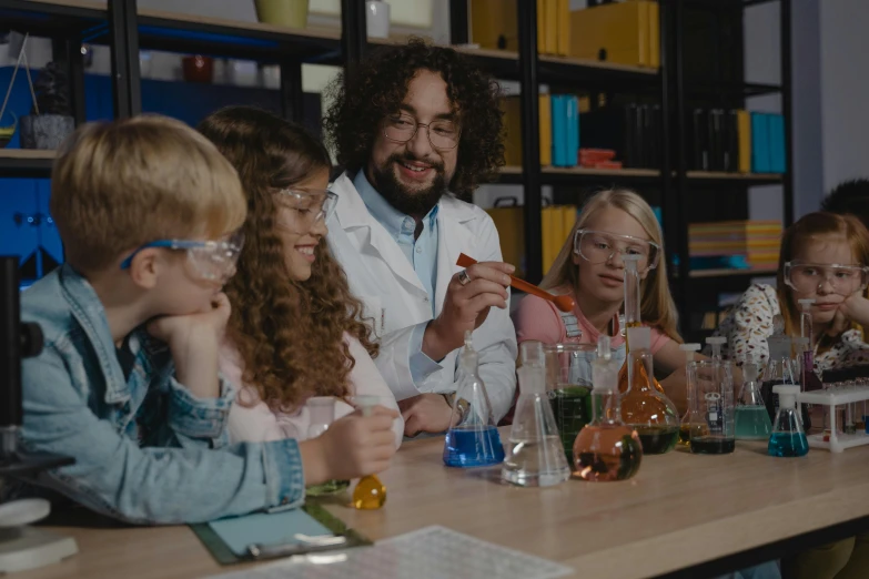 a group of children sitting at a table in a lab, pexels contest winner, foxish guy in a lab coat, profile image, beaker, music video