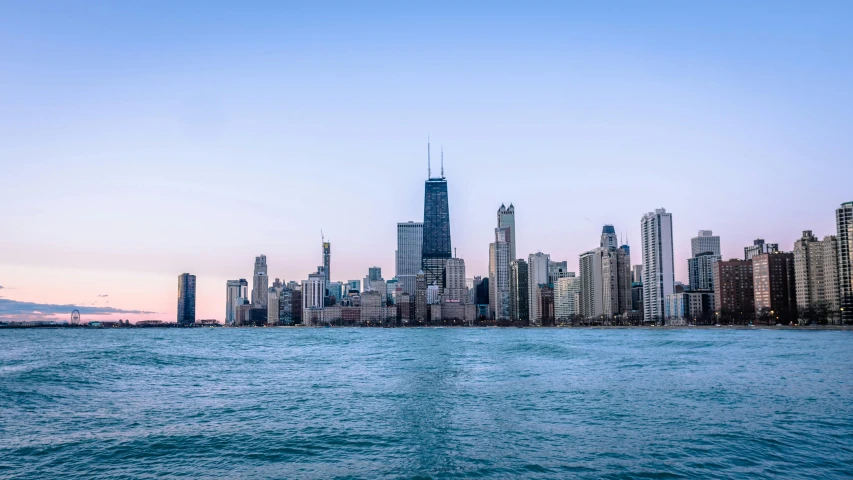 a large body of water with a city in the background, by Ryan Pancoast, pexels contest winner, chicago, the photo was taken from a boat, late afternoon, panoramic