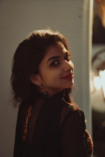 a woman standing in front of a mirror, by Max Dauthendey, pexels contest winner, serial art, portrait of priyanka chopra, at twilight, smiling young woman, lofi