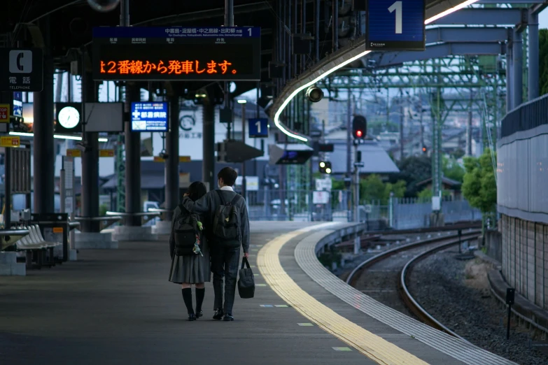 a couple of people walking down a train platform, unsplash, sōsaku hanga, japanese high school, long distance photo, 2022 photograph, 4k)