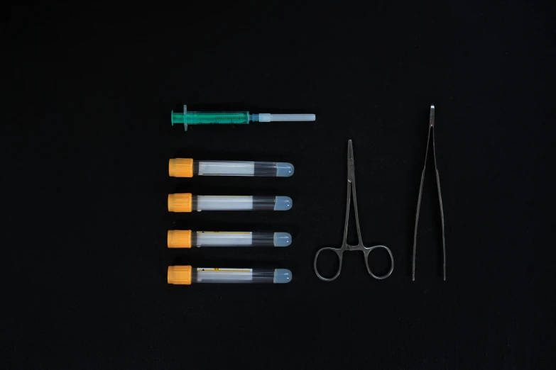 a group of tools sitting on top of a black surface, anaesthetic, product image, highly capsuled, frontal shot