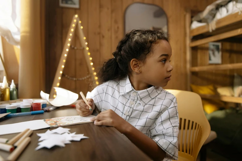 a little girl that is sitting at a table, pexels contest winner, school curriculum expert, holiday, profile image, in a medium full shot