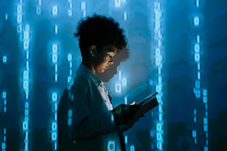 a woman reading a book in the dark, a digital rendering, supercomputer, afro tech, getty images, matrix code