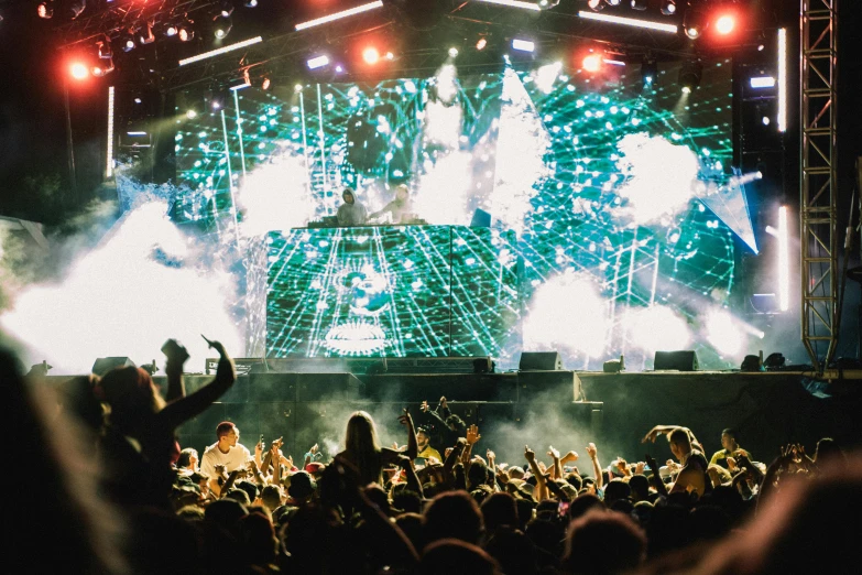 a group of people that are standing in front of a stage, unsplash, happening, photograph of three ravers, large commercial led screens, pistols, flume cover art