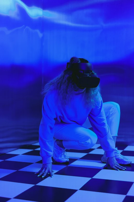 a woman sitting on top of a checkered floor, a hologram, interactive art, wearing a vr headset, indigo, crouching, masked person in corner