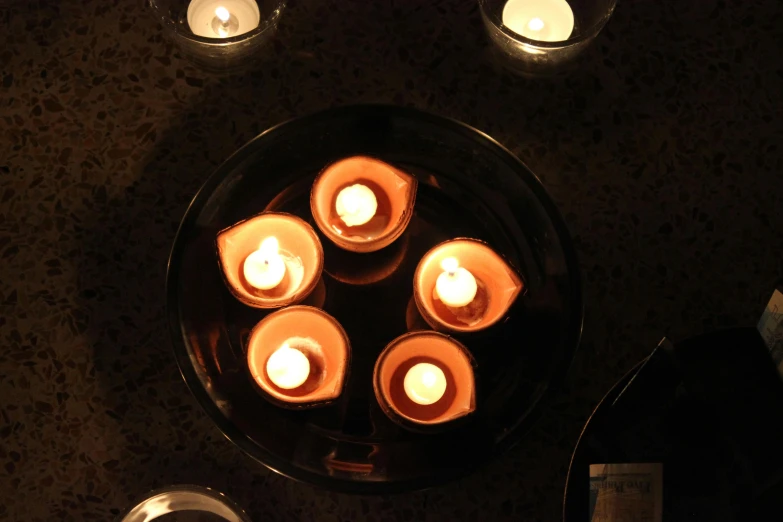 a group of lit candles sitting on top of a table, summoning circle, social media, burning water, ignant