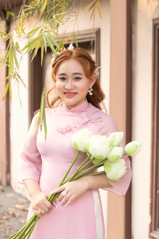 a woman in a pink dress holding a bunch of flowers, inspired by Cui Bai, pexels contest winner, happening, wearing authentic attire, a cute young woman, square, bun )