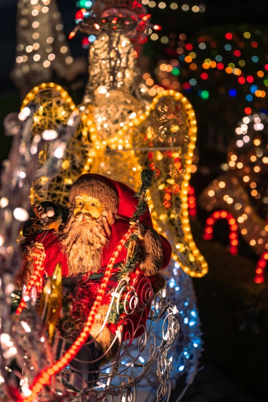 a statue of santa claus surrounded by christmas lights, happening, zoomed in, magical village, f / 2 0, slide show