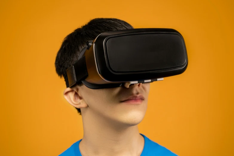 a young man wearing a virtual reality headset, inspired by Goro Fujita, trending on pexels, orange subsurface scattering, black teenage boy, large forehead, official product photo