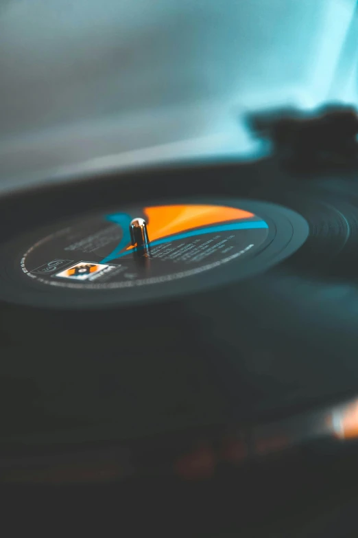 a close up of a record on a turntable, an album cover, trending on pexels, good vibrations, close to night, plain background, jukebox