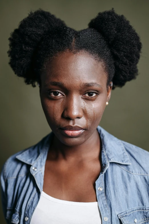 a close up of a person with an afro, a character portrait, by Lily Delissa Joseph, trending on unsplash, hyperrealism, acting headshot, looking serious, kara walker, portrait photo of a backdrop