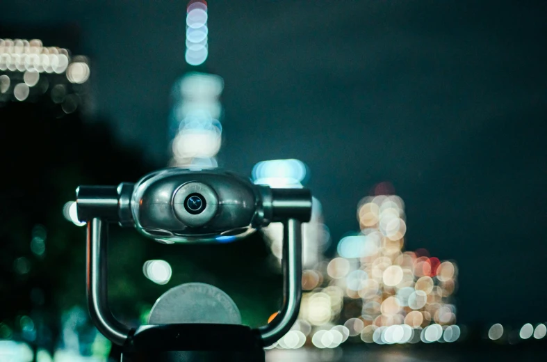 a pair of binoculars sitting on top of a table, by Niko Henrichon, unsplash contest winner, visual art, in tokyo at night, tokyo futuristic in background, f1.8 bokeh, helmet view