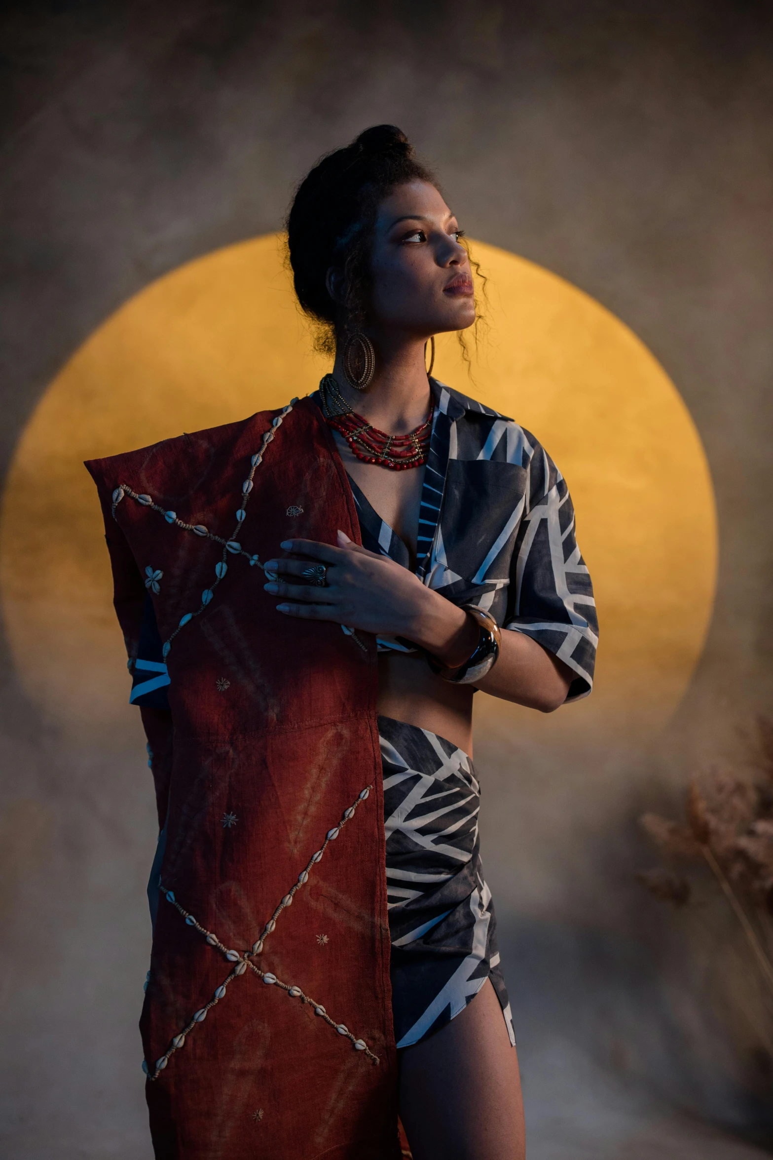 a woman standing in front of a full moon, a portrait, by Kristian Zahrtmann, wearing an elegant tribal outfit, hand painted textures on model, promo image, wearing a kimono