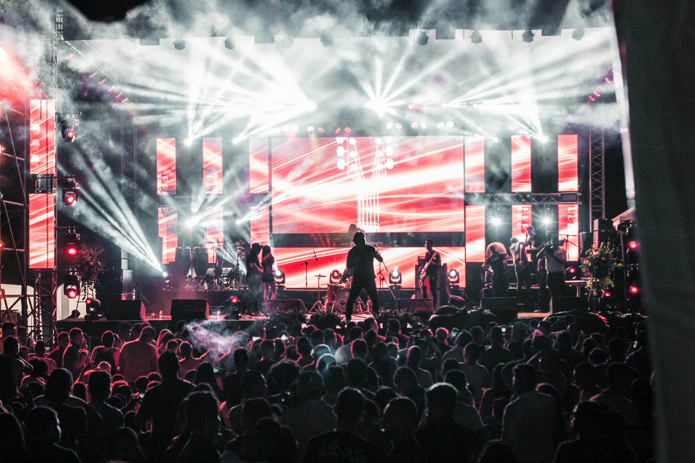 a group of people standing on top of a stage, pretty lights, performing on stage, profile image, billboard image