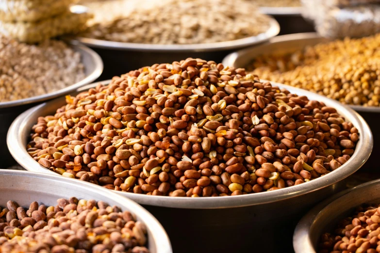 a bunch of bowls filled with different kinds of nuts, a digital rendering, by Julia Pishtar, trending on pexels, made of baked beans, ethiopian, close up of lain iwakura, mineral grains