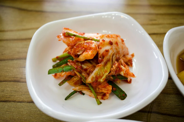 a close up of a plate of food on a table, a picture, inspired by Choi Buk, spicy, square, medium angle, chicken