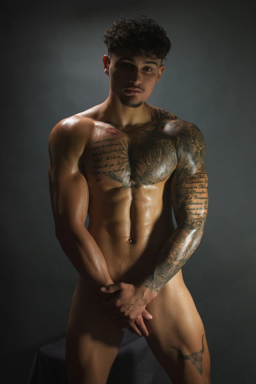 a man with tattoos posing for a picture, inspired by Randy Vargas, wlop glossy skin, high detail”