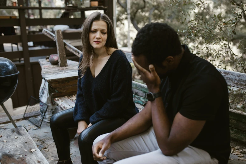 a man and a woman sitting on a bench, stressing out, black man, amanda lilleston, looking her shoulder