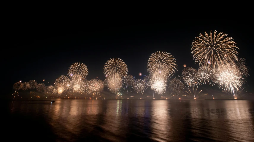 fireworks lights up the night sky over a body of water, pexels contest winner, hurufiyya, arabic, grey, 15081959 21121991 01012000 4k, herzog de meuron