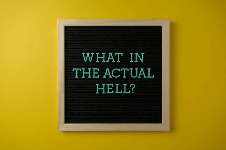 a sign that says what in the actual hell?, trending on pexels, facial actuary, adafruit, big budget horror movie, thermography