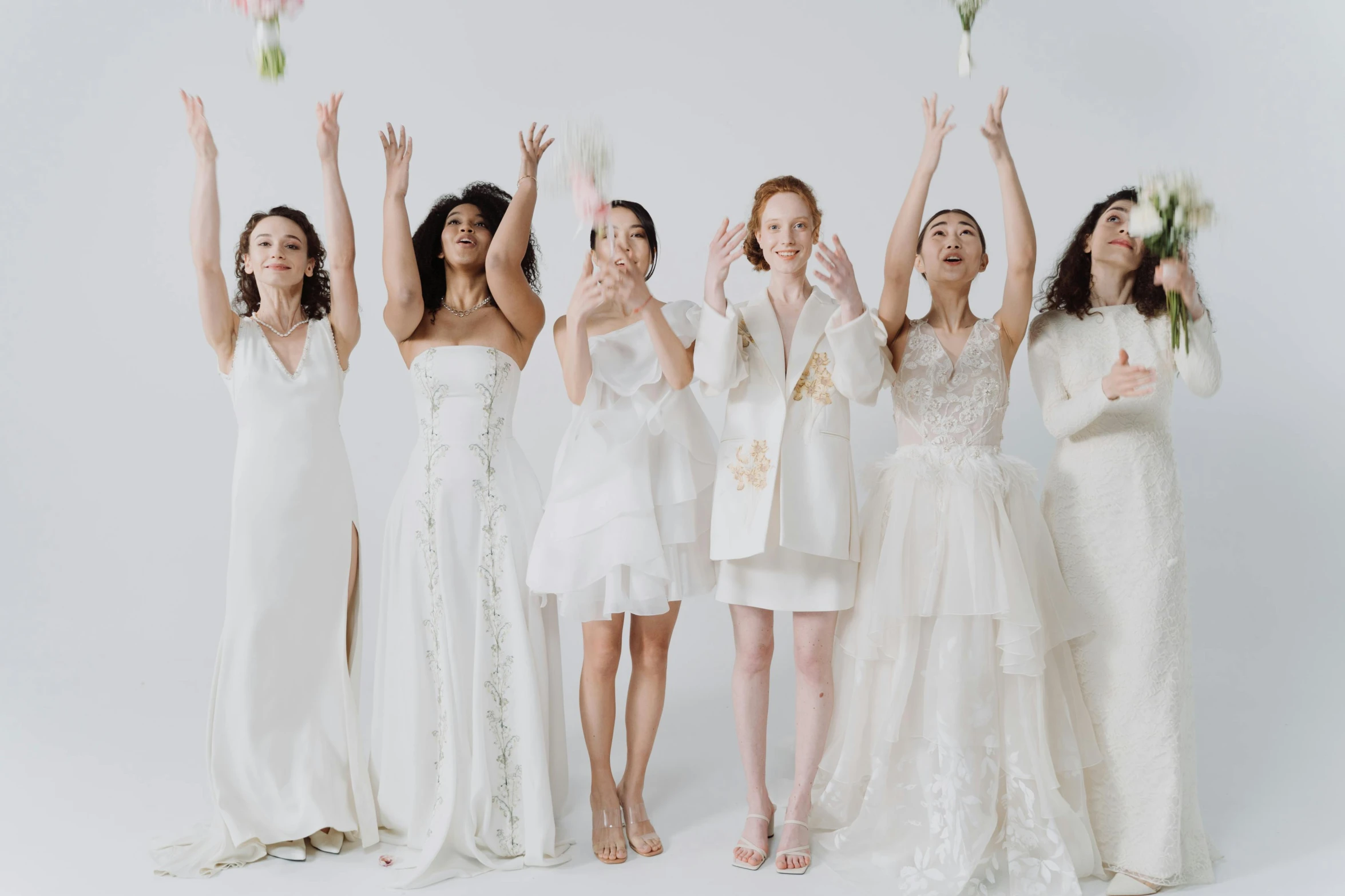 a group of women standing next to each other, by Winona Nelson, trending on pexels, renaissance, white gown, waving at the camera, beauty campaign, bride