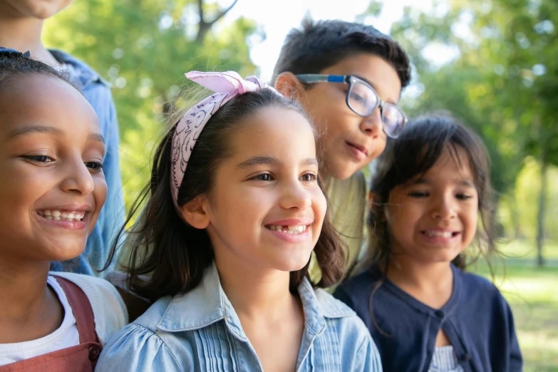 a group of young children standing next to each other, a picture, shutterstock, middle eastern skin, youtube thumbnail, smiling, profile pic