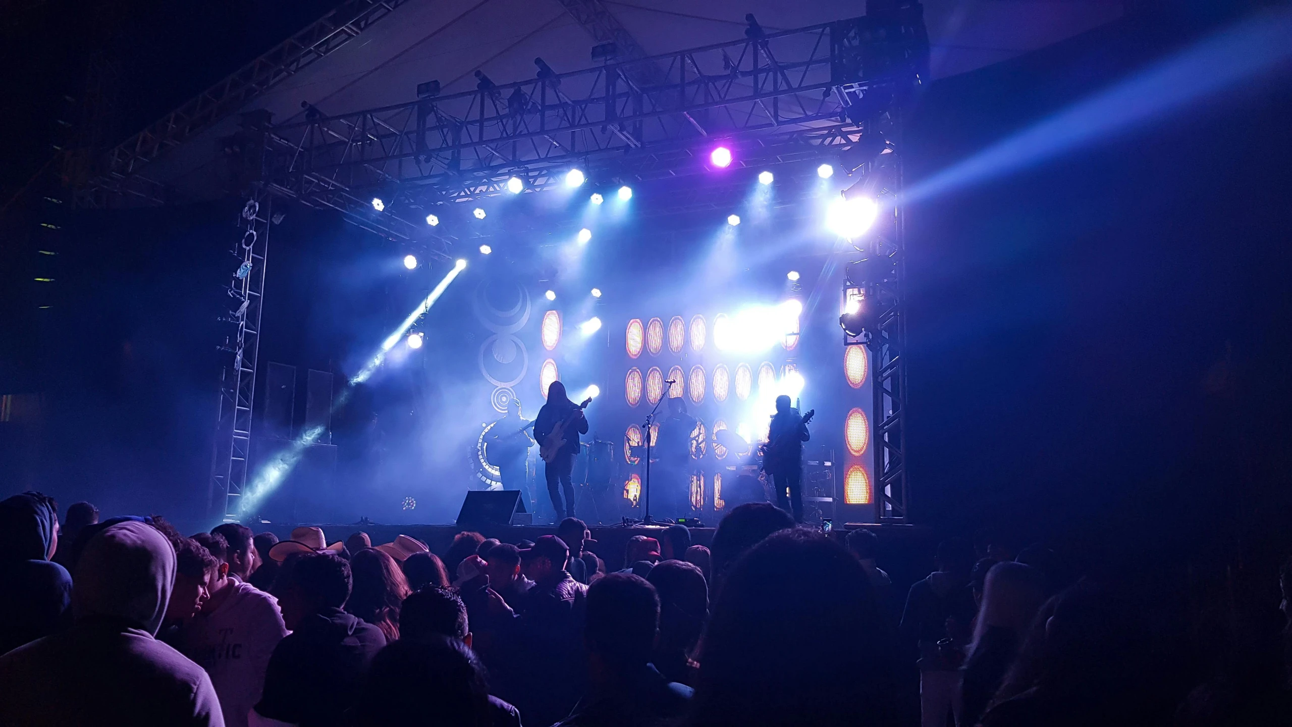 a group of people standing on top of a stage