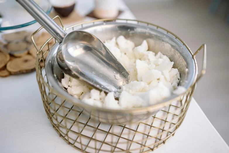 a bowl filled with rice sitting on top of a counter, dry ice, lattice, metal kitchen utensils, thumbnail