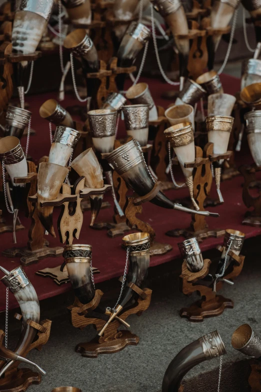 a bunch of items that are on a table, by Daniel Lieske, trending on unsplash, kinetic art, brass horns, wood cups, nepal, many legs