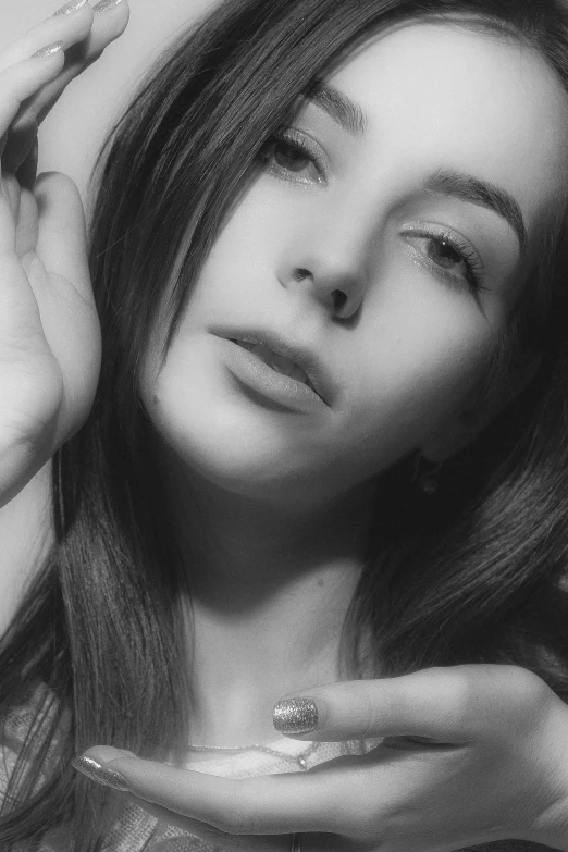 a black and white photo of a woman with long hair, inspired by Ksenia Milicevic, low quality photo, young beautiful amouranth, ((portrait)), silver and sapphire