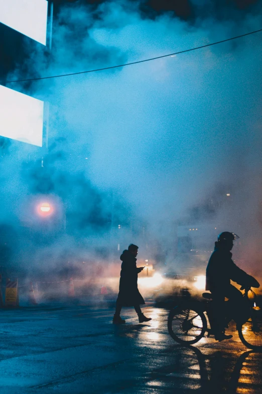 a couple of people that are standing in the street, by Niko Henrichon, pexels contest winner, conceptual art, blue mist, smokey lights, lunar busy street, cold scene