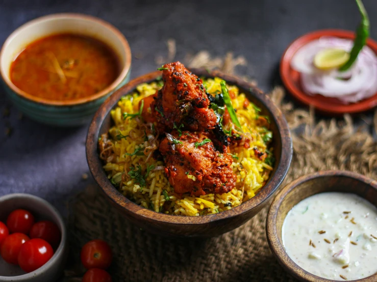 a bowl of food sitting on top of a table, pexels contest winner, hurufiyya, indian, chicken, square, rich in texture )