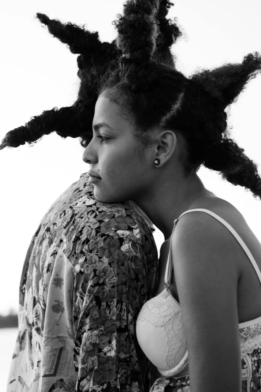 a black and white photo of a woman hugging a man, inspired by Carrie Mae Weems, renaissance, willow smith zendaya, black hair in braids, (golden hour), square